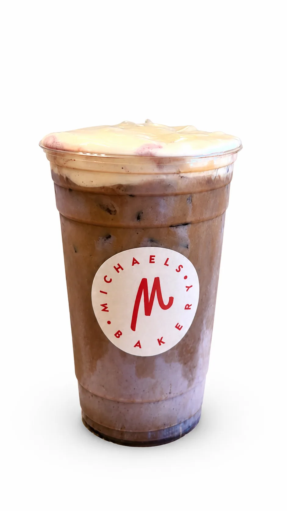 Iced Blueberry Latte in a Michaels Bakery branded cup with blueberry-tinted cold foam on top