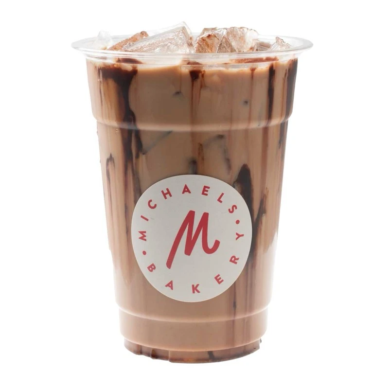 Iced Nutella Mocha Latte in a Michaels Bakery branded cup with chocolate drizzle