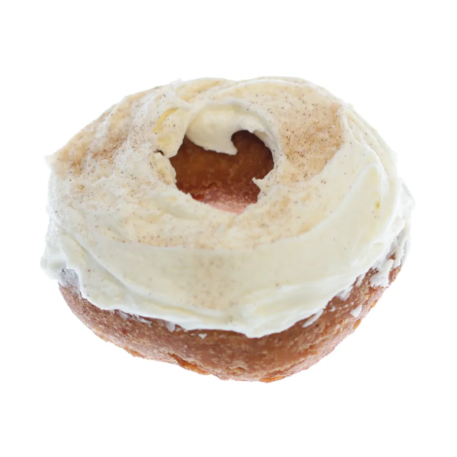 Pumpkin cream cheese iced donut with a thick swirl of cream cheese icing dusted with spice, from Michaels Bakery in Orrville, Ohio